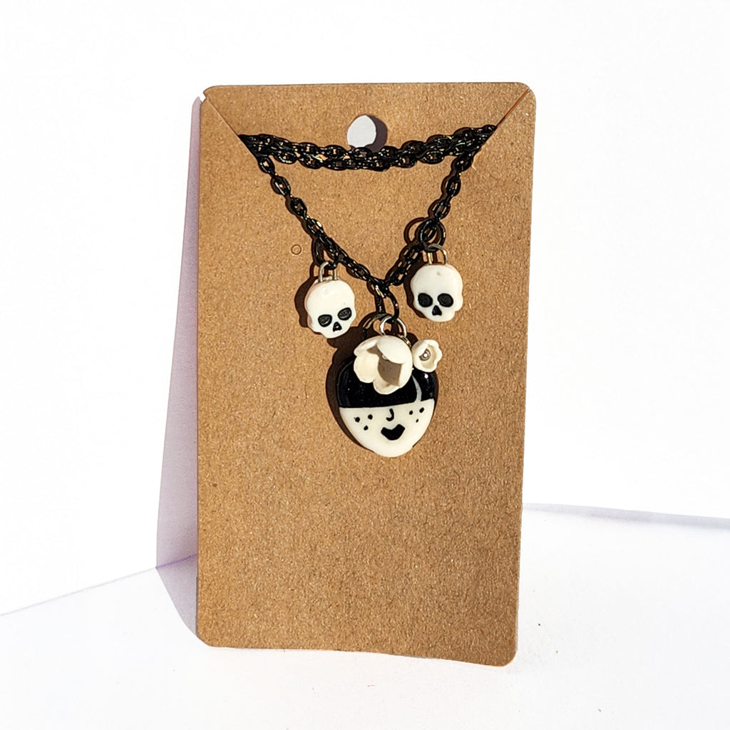 "Odessa" Gothic Charm Necklace - flowers and skulls, 20" black chain